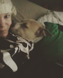 A woman and her dog in a selfie